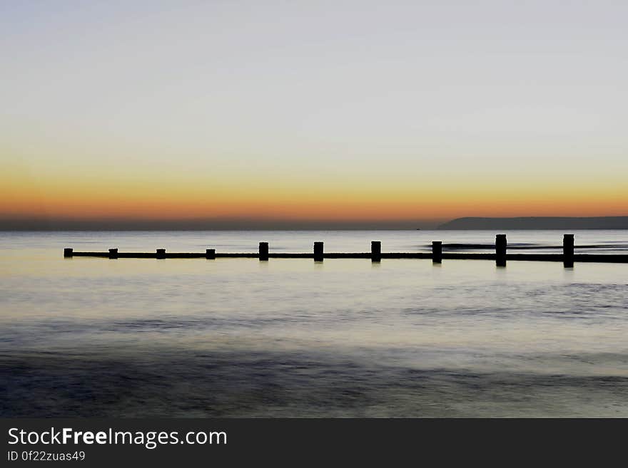 Scenic View of Sea Against Clear Sky during Sunset