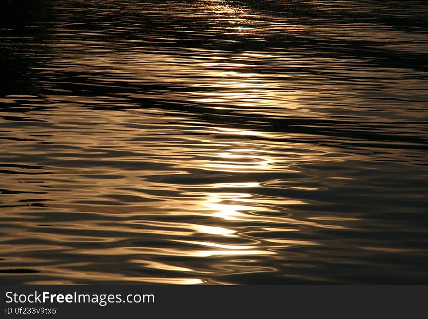 The sun reflecting on the waves at sea. The sun reflecting on the waves at sea.