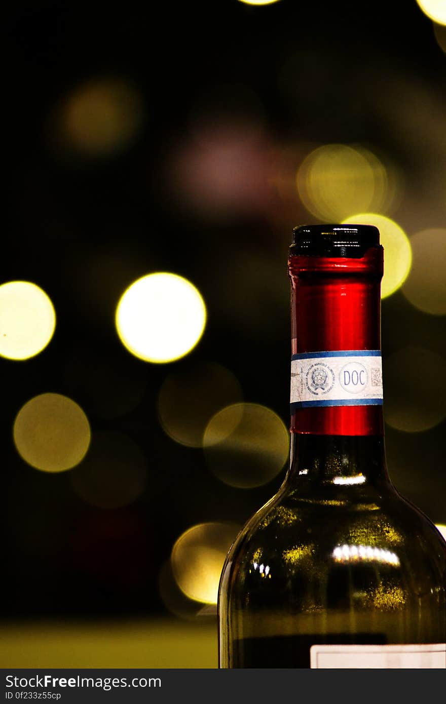 A bottle of wine with blurred bokeh background.