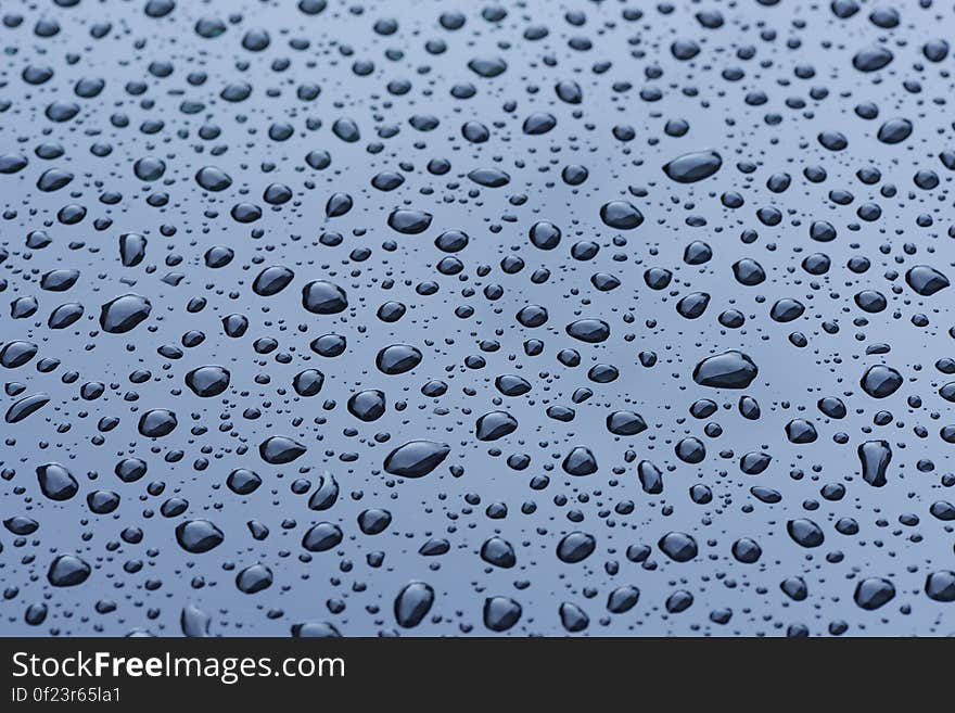 Water Droplets on Blue Surface