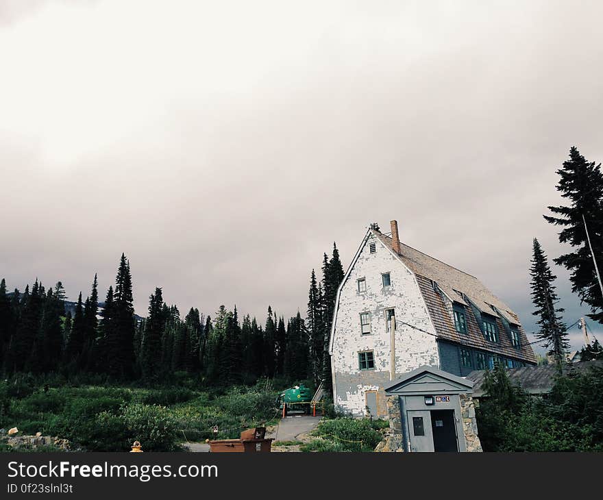 White Gray House Beside Tree&#x27;s during Daytime