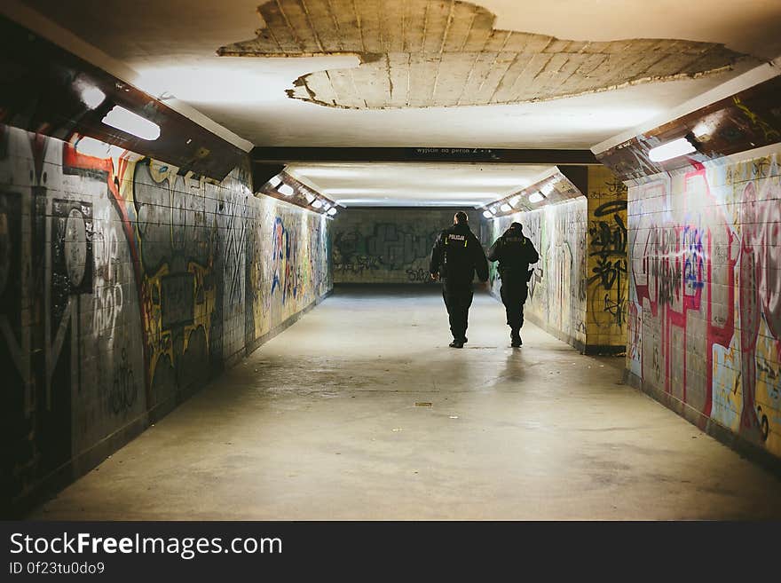 People Walking on Subway With Lights Turned on