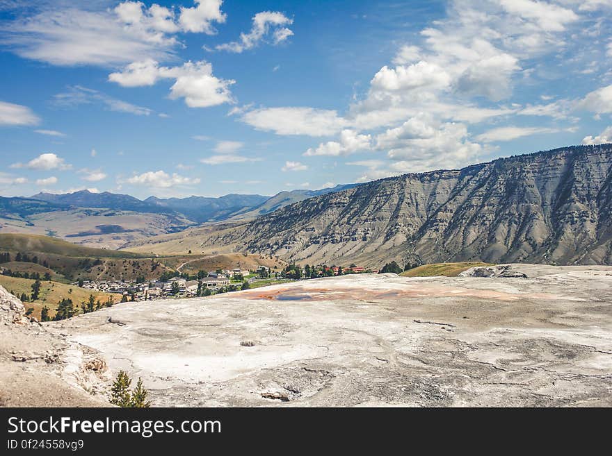 A view from a mountain plateau across the valley and mountains in the distance. A view from a mountain plateau across the valley and mountains in the distance.