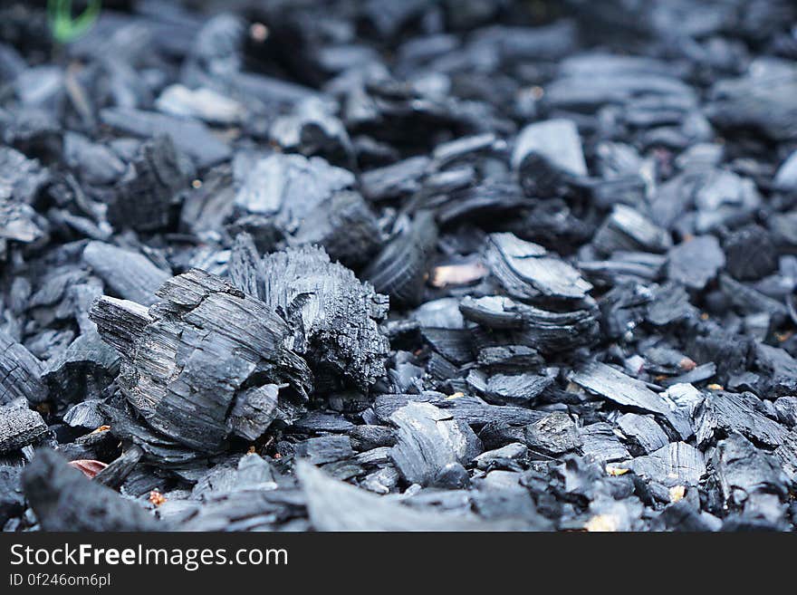 A background of pieces of charcoal.