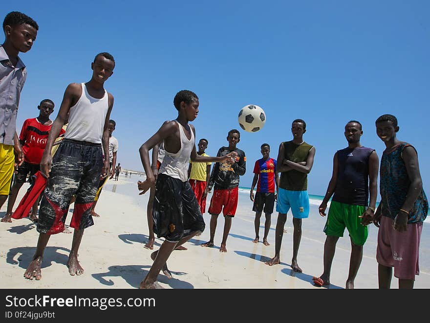 A Somali boy plays &#x27;keep-ups&#x27; with a football as his friends watch on Lido Beach in the Abdul-Aziz district of the Somali capital Mogadishu 09 November 2012. Lido Beach has become a popular spot on Friday&#x27;s with hundreds of Somalis since the withdrawal in August 2011 of the Al-Qaeda affiliated extremist group Al Shabaab who had banned any such social gatherings between men and women. The United Nations Security Council on November 7 renewed the mandate of the African Union Mission in Somalia &#x28;AMISOM&#x29; peacekeeping force for a further four months to continue providing support to the Government of Somalia in its efforts to bring peace and stability to the Horn of African country. AU-UN IST PHOTO / STUART PRICE. A Somali boy plays &#x27;keep-ups&#x27; with a football as his friends watch on Lido Beach in the Abdul-Aziz district of the Somali capital Mogadishu 09 November 2012. Lido Beach has become a popular spot on Friday&#x27;s with hundreds of Somalis since the withdrawal in August 2011 of the Al-Qaeda affiliated extremist group Al Shabaab who had banned any such social gatherings between men and women. The United Nations Security Council on November 7 renewed the mandate of the African Union Mission in Somalia &#x28;AMISOM&#x29; peacekeeping force for a further four months to continue providing support to the Government of Somalia in its efforts to bring peace and stability to the Horn of African country. AU-UN IST PHOTO / STUART PRICE.