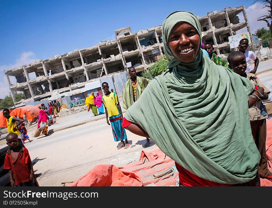 A Somali woman stands in front of a derelict building in the Abdul-Aziz district of the Somali capital Mogadishu 09 November. The United Nations Security Council on November 7 renewed the mandate of the African Union Mission in Somalia &#x28;AMISOM&#x29; peacekeeping force for a further four months to continue providing support to the Government of Somalia in its efforts to bring peace and stability to the Horn of African country. AU-UN IST PHOTO / STUART PRICE. A Somali woman stands in front of a derelict building in the Abdul-Aziz district of the Somali capital Mogadishu 09 November. The United Nations Security Council on November 7 renewed the mandate of the African Union Mission in Somalia &#x28;AMISOM&#x29; peacekeeping force for a further four months to continue providing support to the Government of Somalia in its efforts to bring peace and stability to the Horn of African country. AU-UN IST PHOTO / STUART PRICE.