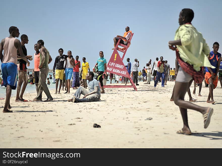 A lifeguard sits watch on LIdo beach in Mogadishu, Somalia, on January 31. The Mogadishu lifeguards, consisting entirely of a volunteer force of fisherman, began patrolling Lido beach in September 2013 after a spate of drownings. Mogadishu&#x27;s beaches have become a popular destination for the city&#x27;s residents since al Shabab withdrew the majority of its militants from the city in 2011. AU UN IST PHOTO / Tobin Jones. A lifeguard sits watch on LIdo beach in Mogadishu, Somalia, on January 31. The Mogadishu lifeguards, consisting entirely of a volunteer force of fisherman, began patrolling Lido beach in September 2013 after a spate of drownings. Mogadishu&#x27;s beaches have become a popular destination for the city&#x27;s residents since al Shabab withdrew the majority of its militants from the city in 2011. AU UN IST PHOTO / Tobin Jones