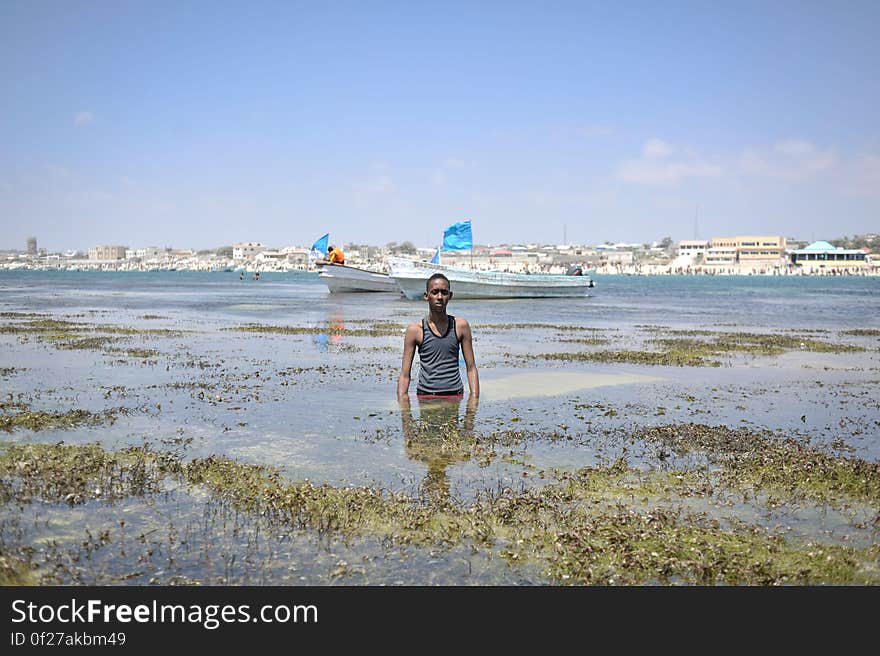 A young man enjoys the waters off of Lido beach in Mogadishu, Somalia, on January 31. The Mogadishu lifeguards, consisting entirely of a volunteer force of fisherman, began patrolling Lido beach in September 2013 after a spate of drownings. Mogadishu&#x27;s beaches have become a popular destination for the city&#x27;s residents since al Shabab withdrew the majority of its militants from the city in 2011. AU UN IST PHOTO / Tobin Jones. A young man enjoys the waters off of Lido beach in Mogadishu, Somalia, on January 31. The Mogadishu lifeguards, consisting entirely of a volunteer force of fisherman, began patrolling Lido beach in September 2013 after a spate of drownings. Mogadishu&#x27;s beaches have become a popular destination for the city&#x27;s residents since al Shabab withdrew the majority of its militants from the city in 2011. AU UN IST PHOTO / Tobin Jones