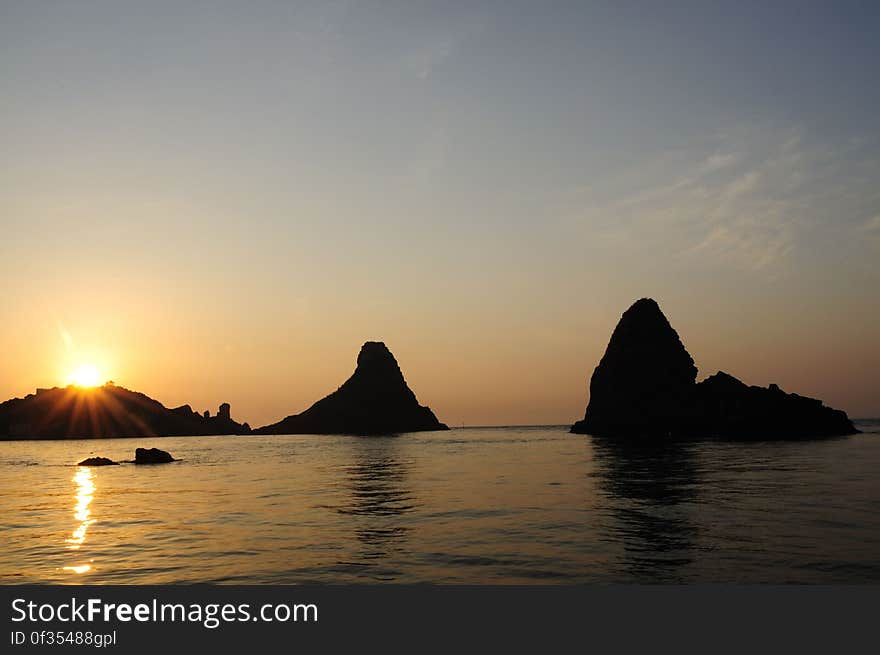 See more ... www.flickr.com/photos/gnuckx The Islands of the Cyclops Of the coast of Aci Trezza are three tall, column-shaped islands. According to local legend, these great stones are the ones thrown at Odysseus in The Odyssey. The islands are referred to as the &quot;isole dei ciclopi&quot; &#x28;islands of the Cyclops, or Cyclopean Isles&#x29; by locals. This compliments the notion that the Cyclops once had a smithy below Mount Etna, which looms over the village to the northwest. Aci Trezza is a town in Sicily, southern Italy, a frazione of the comune of Aci Castello, c. 10 km north of Catania, with a population of around 5,000 people. Located on the coast of the Ionian Sea, the village has a long history of maritime activity. Aci Trezza is a popular spot for Italian vacationers in the summer. The patron Saint of the town is St. John the Baptist. The Festa of San Giovanni is celebrated each year during the last week of June 24 in his honor. Le Isole dei Ciclopi Il panorama di Aci Trezza Ã¨ dominato dai faraglioni dei Ciclopi: otto pittoreschi scogli basaltici che, secondo la leggenda, furono lanciati da Polifemo ad Ulisse durante la sua fuga. I faraglioni compaiono sugli stemmi dei comuni di Aci Castello, Acireale, Aci Bonaccorsi, Aci Catena. Poco distante dalla costa &#x28;a circa 400 m di distanza&#x29;, Ã¨ presente l&#x27;Isola Lachea, identificata con l&#x27;omerica Isola delle Capre e che attualmente ospita la sede di una stazione di studi di biologia dell&#x27;UniversitÃ  degli Studi di Catania. See more ... www.flickr.com/photos/gnuckx The Islands of the Cyclops Of the coast of Aci Trezza are three tall, column-shaped islands. According to local legend, these great stones are the ones thrown at Odysseus in The Odyssey. The islands are referred to as the &quot;isole dei ciclopi&quot; &#x28;islands of the Cyclops, or Cyclopean Isles&#x29; by locals. This compliments the notion that the Cyclops once had a smithy below Mount Etna, which looms over the village to the northwest. Aci Trezza is a town in Sicily, southern Italy, a frazione of the comune of Aci Castello, c. 10 km north of Catania, with a population of around 5,000 people. Located on the coast of the Ionian Sea, the village has a long history of maritime activity. Aci Trezza is a popular spot for Italian vacationers in the summer. The patron Saint of the town is St. John the Baptist. The Festa of San Giovanni is celebrated each year during the last week of June 24 in his honor. Le Isole dei Ciclopi Il panorama di Aci Trezza Ã¨ dominato dai faraglioni dei Ciclopi: otto pittoreschi scogli basaltici che, secondo la leggenda, furono lanciati da Polifemo ad Ulisse durante la sua fuga. I faraglioni compaiono sugli stemmi dei comuni di Aci Castello, Acireale, Aci Bonaccorsi, Aci Catena. Poco distante dalla costa &#x28;a circa 400 m di distanza&#x29;, Ã¨ presente l&#x27;Isola Lachea, identificata con l&#x27;omerica Isola delle Capre e che attualmente ospita la sede di una stazione di studi di biologia dell&#x27;UniversitÃ  degli Studi di Catania.