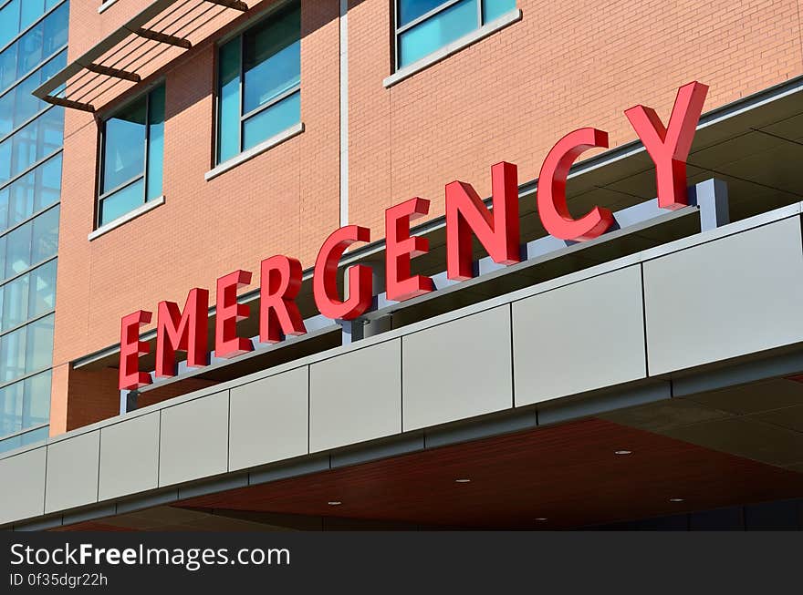 Emergency sign on exterior awning of building.