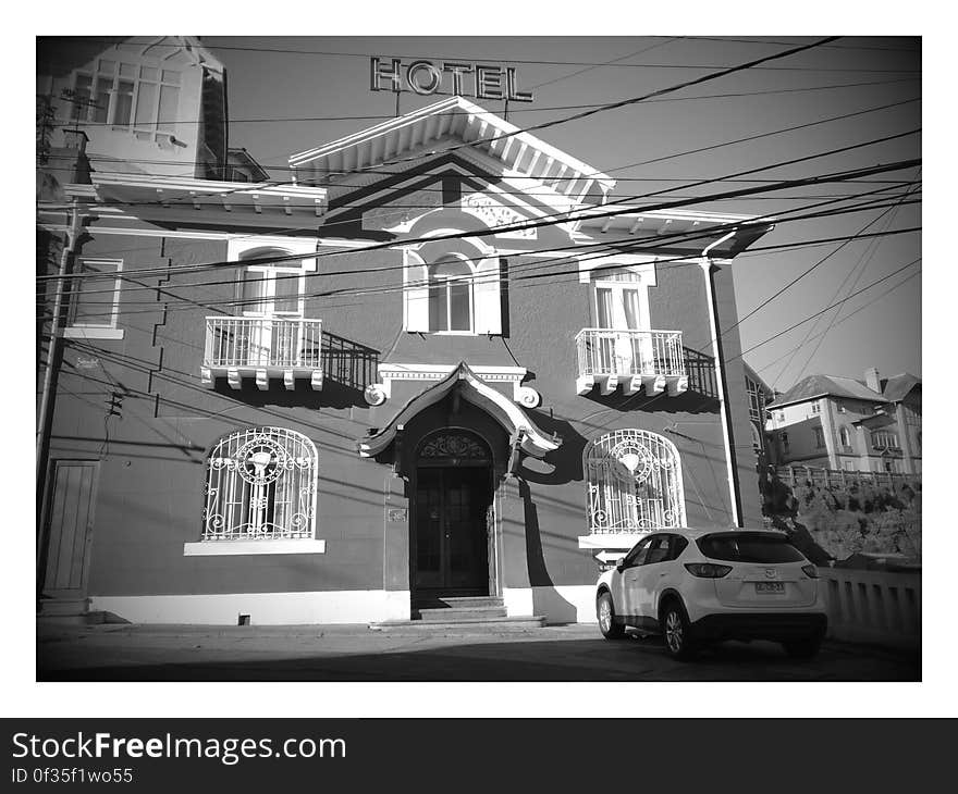 A monochrome photo of an old fashioned hotel in Cerro Castillo in Chile.