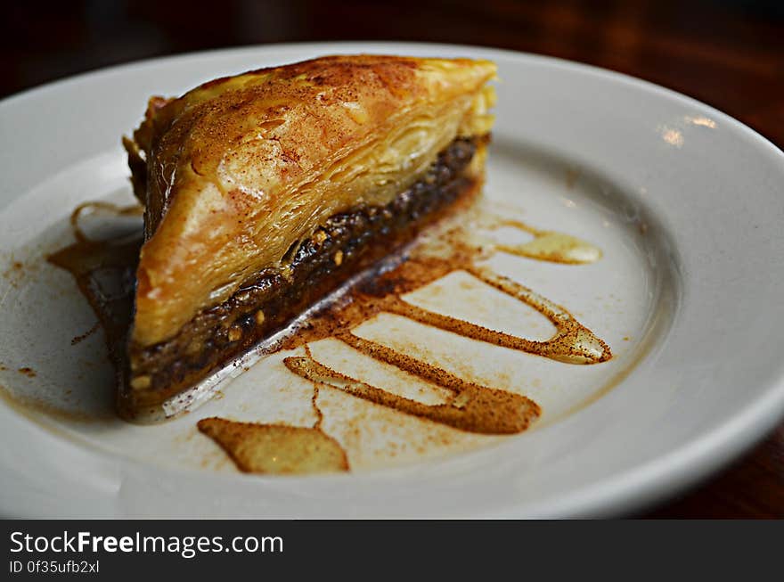 A piece of cake made with puff pastry on plate. A piece of cake made with puff pastry on plate.