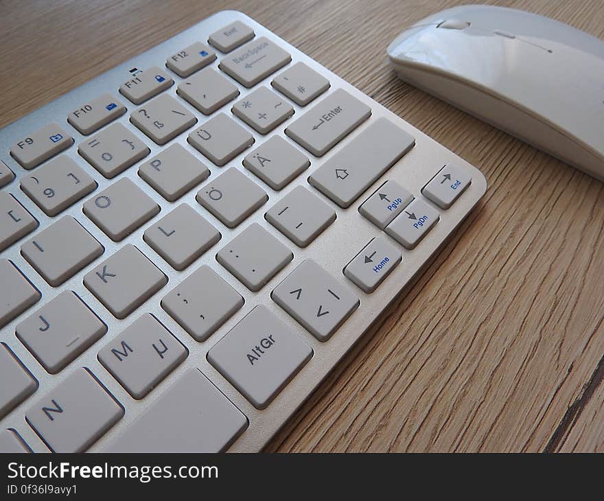 A close up of computer keyboard and mouse.