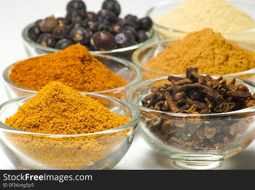 Glass bowls with various spices. Glass bowls with various spices.