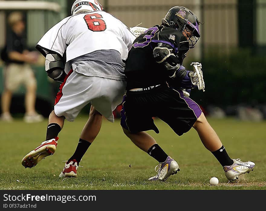 2 Men Playing Football during Daytime