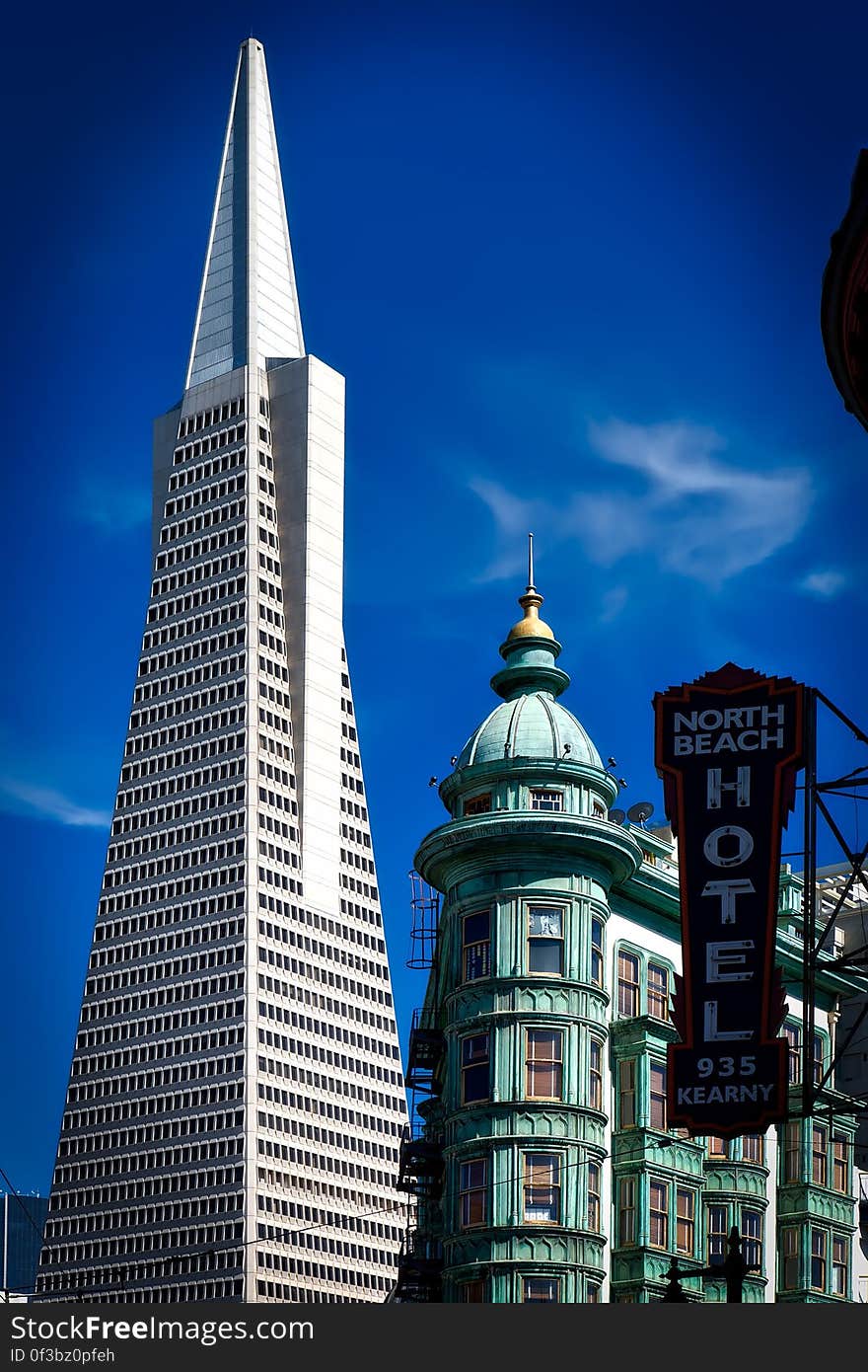 North Beach Hotel 935 Kearny Signage over the High Rise Tower Under Blue Sky