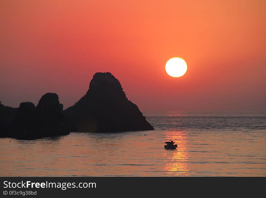 Aci Castello &#x28;Sicilian: Jaci Casteá¸á¸u&#x29; is a city and comune in the Province of Catania in Sicily, Italy. The city is located 9 km north of Catania on the Mediterranean coast. The primary economic sectors are agriculture and industry &#x28;in Catania&#x29;. The city is neighbored by Aci Catena, Acireale, Catania, San Gregorio di Catania and Valverde. The city developed around the castle, which was built in 1076 by the Normans. In 1169, Aci Castello started to grow after an eruption of Mount Etna made the towns around it uninhabitable. Close to Aci Castello are the Islands of the Cyclops in nearby Acitrezza. Off the coast of Aci Trezza are three tall, column-shaped islands. According to local legend, these great stones are the ones thrown at Odysseus in The Odyssey. The islands are referred to as the &#x22;isole dei ciclopi&#x22; &#x28;islands of the Cyclops, or Cyclopean Isles&#x29; by locals. This compliments the notion that the Cyclops once had a smithy below Mount Etna, which looms over the village to the northwest. Aci Castello &#x28;Sicilian: Jaci Casteá¸á¸u&#x29; is a city and comune in the Province of Catania in Sicily, Italy. The city is located 9 km north of Catania on the Mediterranean coast. The primary economic sectors are agriculture and industry &#x28;in Catania&#x29;. The city is neighbored by Aci Catena, Acireale, Catania, San Gregorio di Catania and Valverde. The city developed around the castle, which was built in 1076 by the Normans. In 1169, Aci Castello started to grow after an eruption of Mount Etna made the towns around it uninhabitable. Close to Aci Castello are the Islands of the Cyclops in nearby Acitrezza. Off the coast of Aci Trezza are three tall, column-shaped islands. According to local legend, these great stones are the ones thrown at Odysseus in The Odyssey. The islands are referred to as the &#x22;isole dei ciclopi&#x22; &#x28;islands of the Cyclops, or Cyclopean Isles&#x29; by locals. This compliments the notion that the Cyclops once had a smithy below Mount Etna, which looms over the village to the northwest.