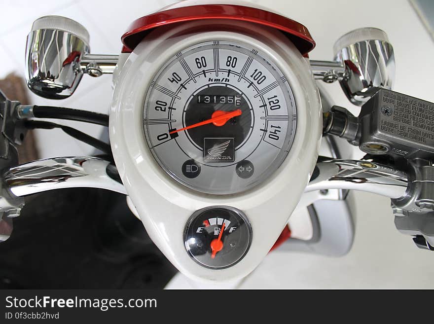 White and Red Motorcycle Gauge