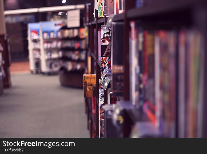 Books on wooden shelves in bookstore. Books on wooden shelves in bookstore.