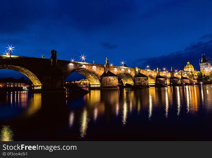 Brown and Black Concrete Bridge during Night