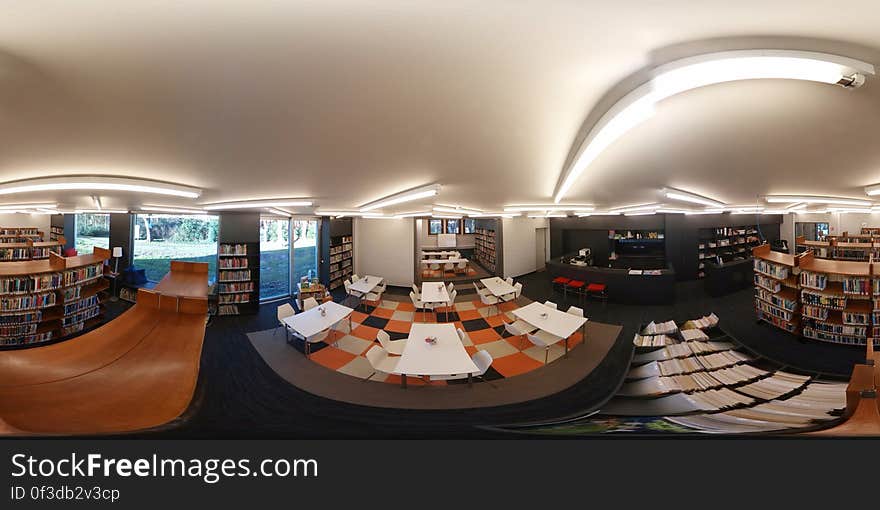 Inside modern library or bookstore reading room with shelves. Inside modern library or bookstore reading room with shelves.