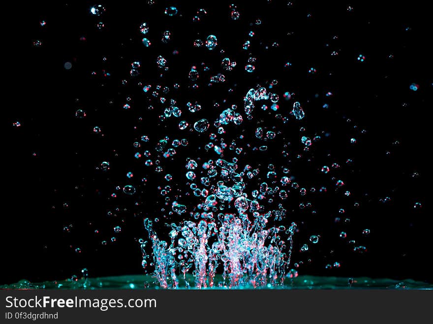 A close up of abstract water bubbles on a black background.