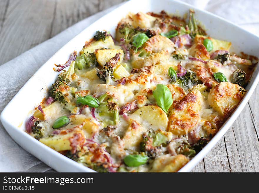 A baked casserole with vegetables, meat and cheese.