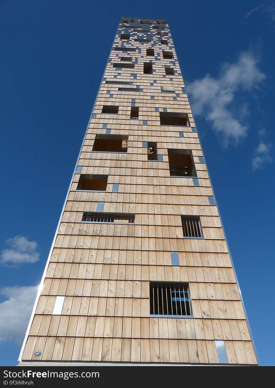 A tall modern building from low angle.