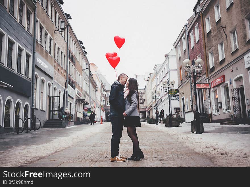 Couple Walking on City Street