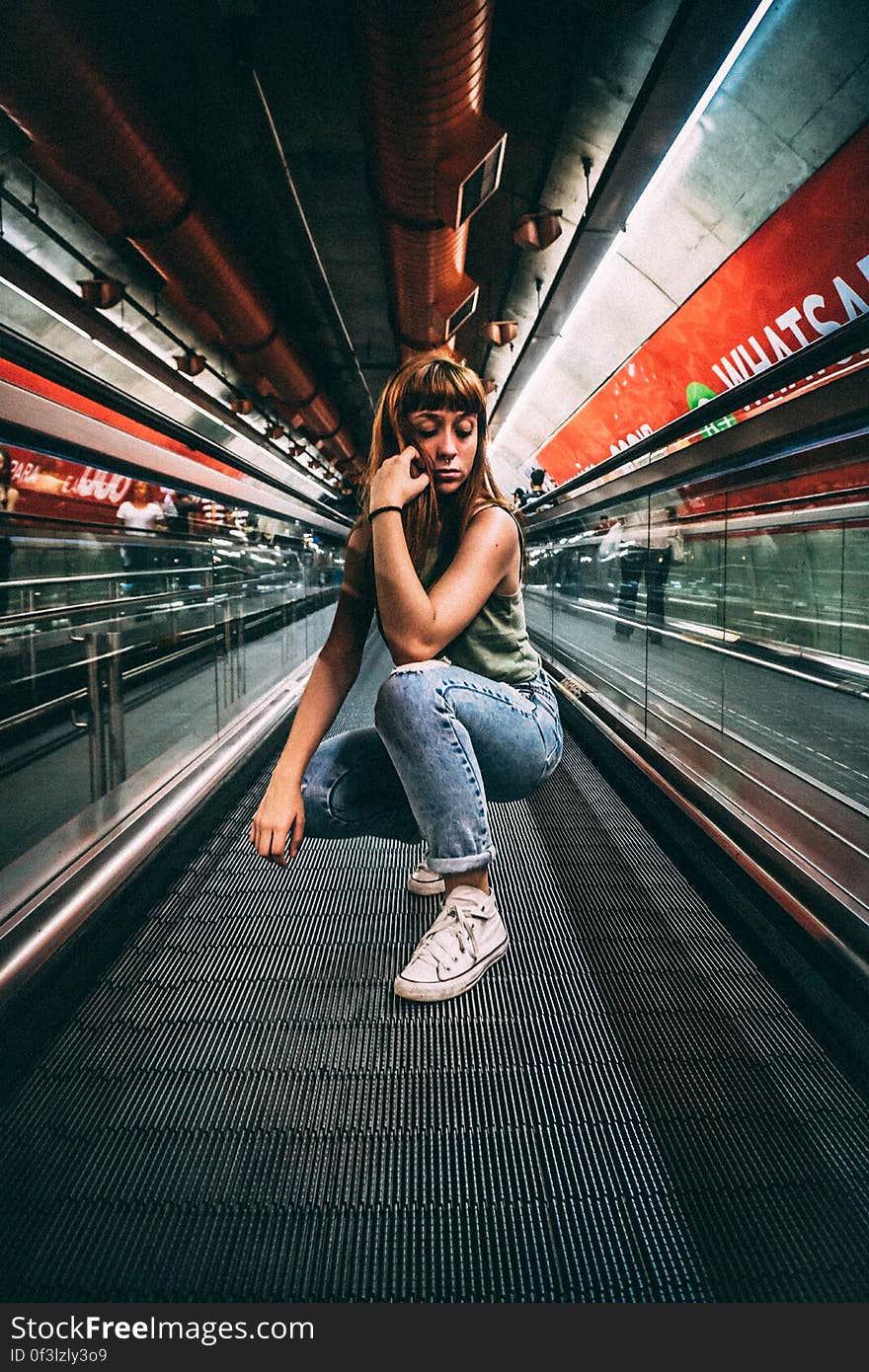 Woman Sitting in a Building