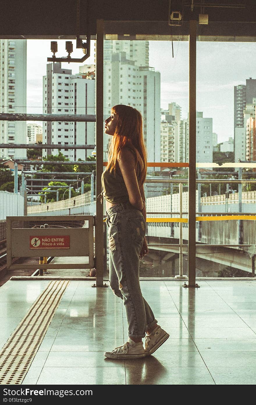 Woman Looking Through Window