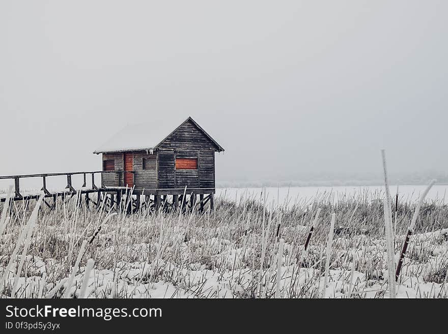 Barn on Field Against Clear Sky during Winter