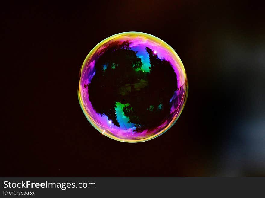 A colorful soap bubble floating in mid air.