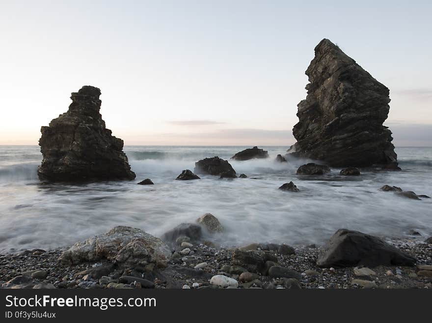 A rocky beach at sunset, long exposure.