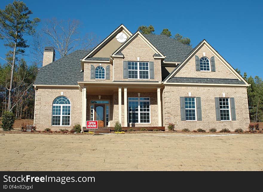 A stylish residential house with a porch. A stylish residential house with a porch.