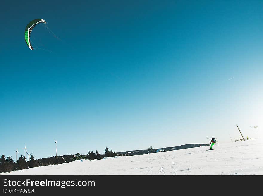 Man Skiing on Snow Covered Landscape