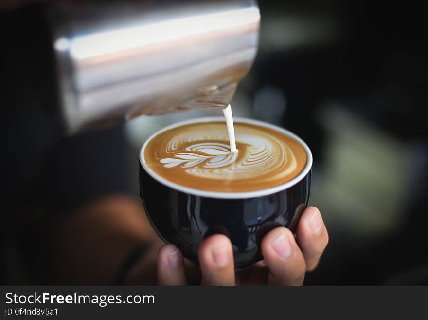 Close-up of Woman Holding Coffee Cup at Cafe