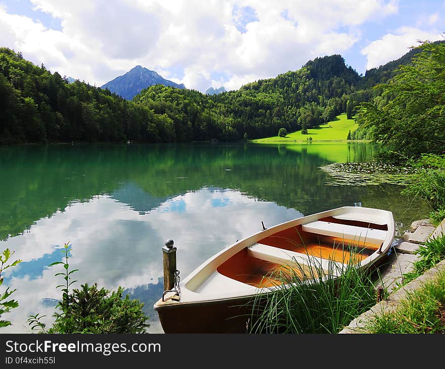 Boat near lake in the mountains, summer time