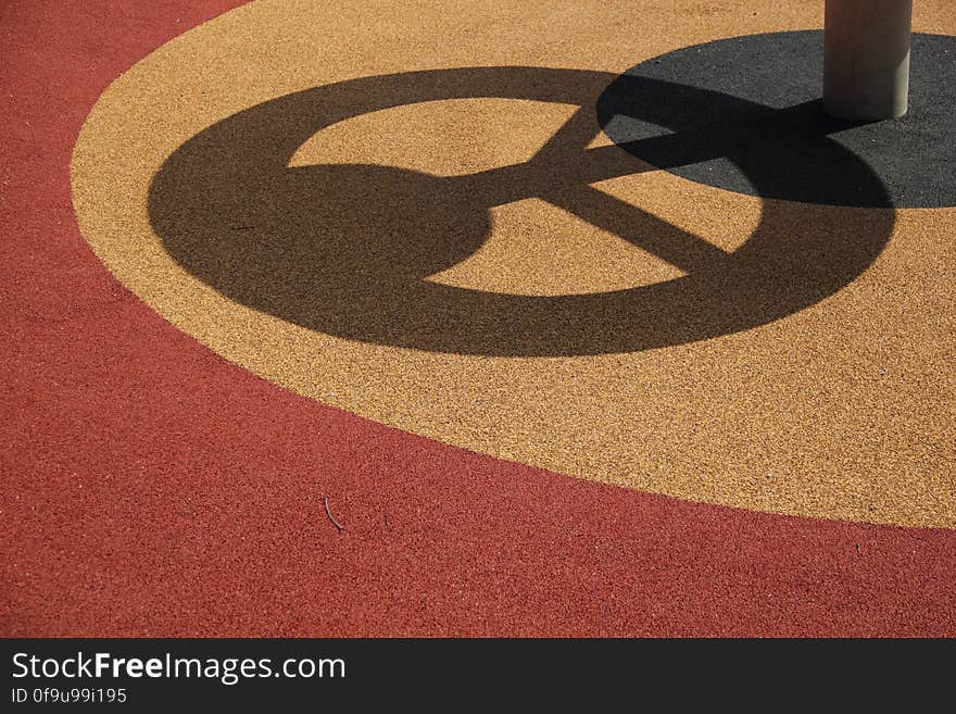 Playground thingie threw a peaceful shadow. Playground thingie threw a peaceful shadow.