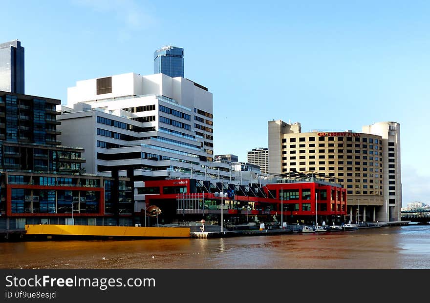 WTC Wharf &#x28;formerly the World Trade Centre and WTC Northbank&#x29; is a twelve-storey office complex on the north bank of the Yarra River in Melbourne, Australia.On 19 December 1978, the Government of Victoria passed the Port of Melbourne &#x28;World Trade Centre&#x29; Act 1978, vesting the Port of Melbourne Authority with authority to construct, maintain and operate a World Trade Centre in the Port of Melbourne.The centre, an example of Brutalist architecture, was built in the early 1980s and opened in 1983. On 30 June 1994, Melbourne&#x27;s first casino, Crown Casino opened in the World Trade Centre. The location was a temporary measure while Crown&#x27;s permanent home, the Crown Casino and Entertainment Complex was constructed across the Yarra river at Southbank In 1997, the centre hosted a temporary exhibition of waxworks from the Madame Tussauds wax museum in London. The building currently houses some offices of the headquarters of Victoria Police, and the Victoria Police Museum, a collection of exhibits and memorabilia from over 150 years of policing in Victoria. It also houses offices for companies, including Thales Australia. The WTC shopping centre is undergoing redevelopment, including the proposed installation of an environmentally friendly air-conditioning system using water from the Yarra River. Further redevelopment plans include construction of restaurants, cafes, a hotel, a wine store, a function centre, and a health and beauty centre. WTC Wharf &#x28;formerly the World Trade Centre and WTC Northbank&#x29; is a twelve-storey office complex on the north bank of the Yarra River in Melbourne, Australia.On 19 December 1978, the Government of Victoria passed the Port of Melbourne &#x28;World Trade Centre&#x29; Act 1978, vesting the Port of Melbourne Authority with authority to construct, maintain and operate a World Trade Centre in the Port of Melbourne.The centre, an example of Brutalist architecture, was built in the early 1980s and opened in 1983. On 30 June 1994, Melbourne&#x27;s first casino, Crown Casino opened in the World Trade Centre. The location was a temporary measure while Crown&#x27;s permanent home, the Crown Casino and Entertainment Complex was constructed across the Yarra river at Southbank In 1997, the centre hosted a temporary exhibition of waxworks from the Madame Tussauds wax museum in London. The building currently houses some offices of the headquarters of Victoria Police, and the Victoria Police Museum, a collection of exhibits and memorabilia from over 150 years of policing in Victoria. It also houses offices for companies, including Thales Australia. The WTC shopping centre is undergoing redevelopment, including the proposed installation of an environmentally friendly air-conditioning system using water from the Yarra River. Further redevelopment plans include construction of restaurants, cafes, a hotel, a wine store, a function centre, and a health and beauty centre.