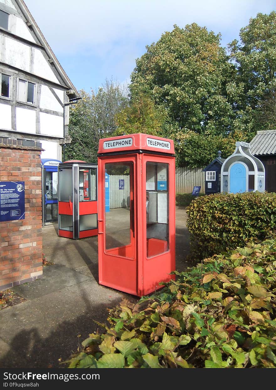 In the foreground is a 1960s phone box of which there were once 11,000. Now they&#x27;re nearly all gone, far outnumbered by both newer and older versions. Looks plasticky but actually iron! The very space age, red-trimmed metal and glass box behind is from 1959 and never went into production - too modern, we guess!. In the foreground is a 1960s phone box of which there were once 11,000. Now they&#x27;re nearly all gone, far outnumbered by both newer and older versions. Looks plasticky but actually iron! The very space age, red-trimmed metal and glass box behind is from 1959 and never went into production - too modern, we guess!