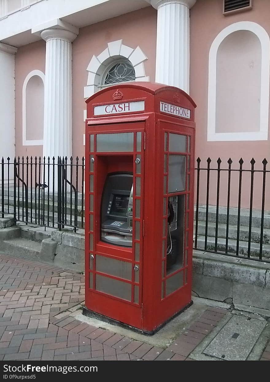 Quite a nice updating of an old red phone box. Payphone and a free cash machine - what more could you want?. Quite a nice updating of an old red phone box. Payphone and a free cash machine - what more could you want?