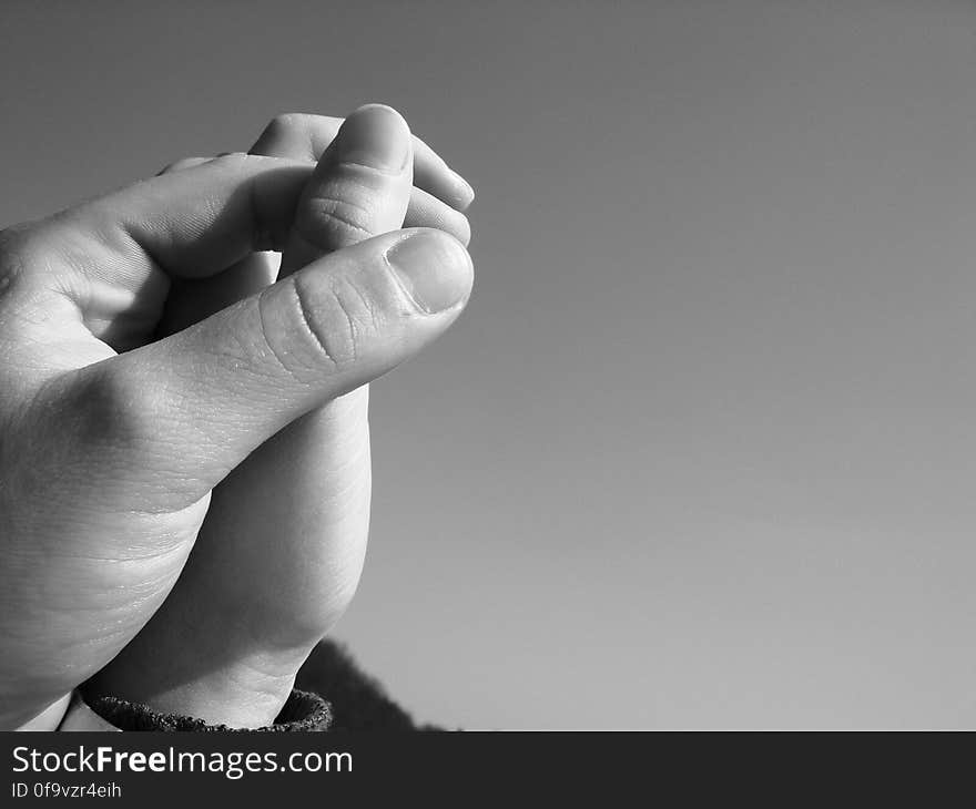 Grayscale Photography of Human Hand Holding Hands