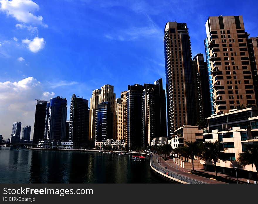 View of Skyscrapers Against Cloudy Sky