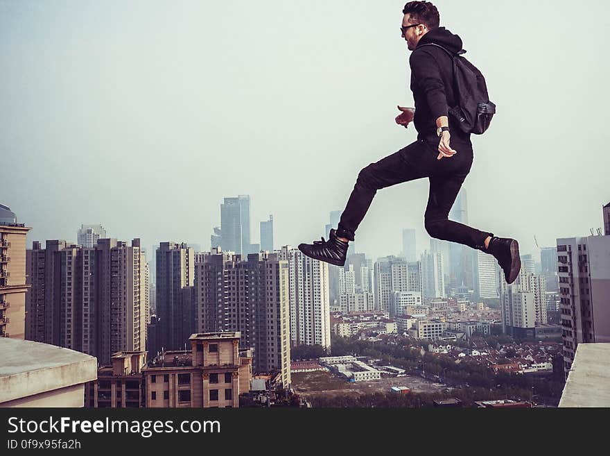 Man Jumping in City