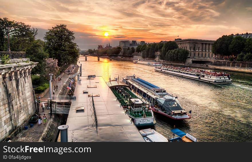 Boats on a River Next to Buildings