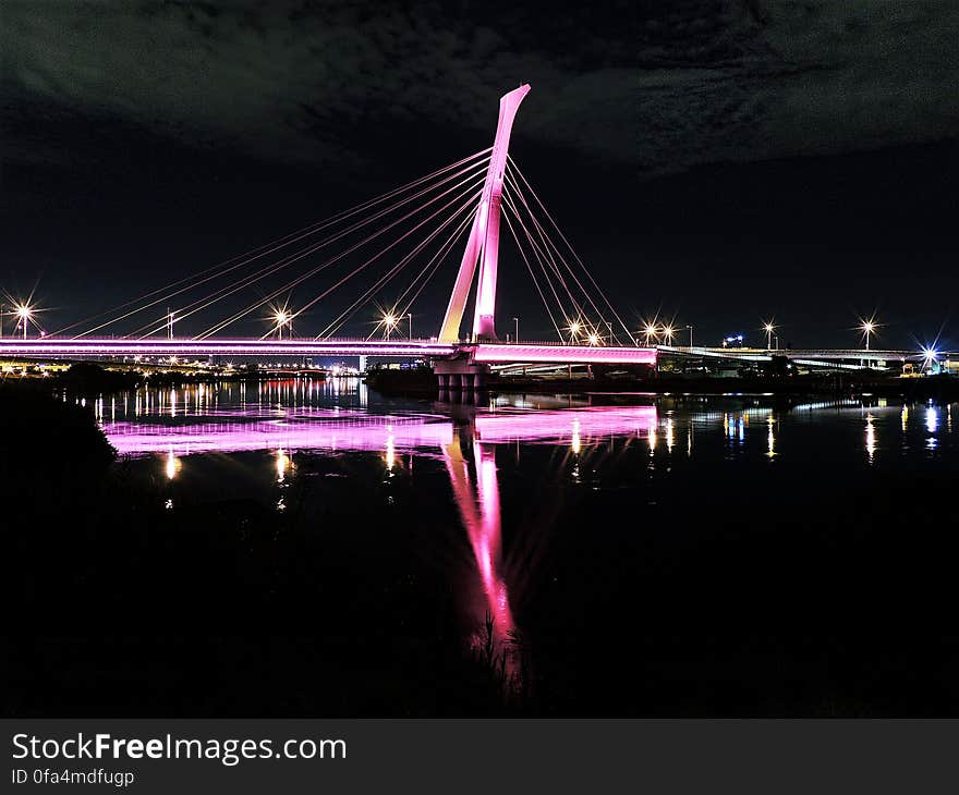 An illuminated bridge in the night. An illuminated bridge in the night.