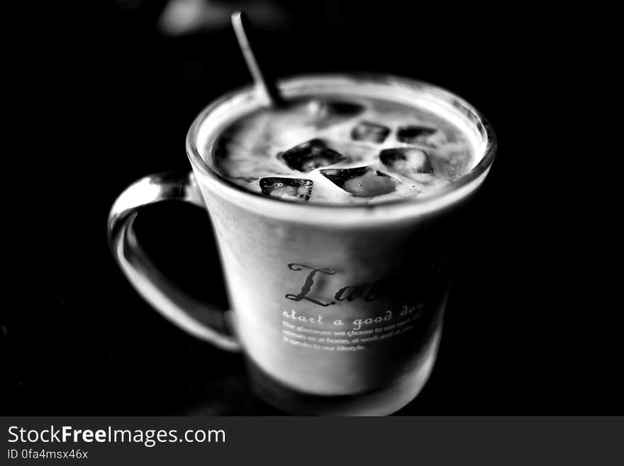 Grayscale Photo of Cup With Ice Cubes