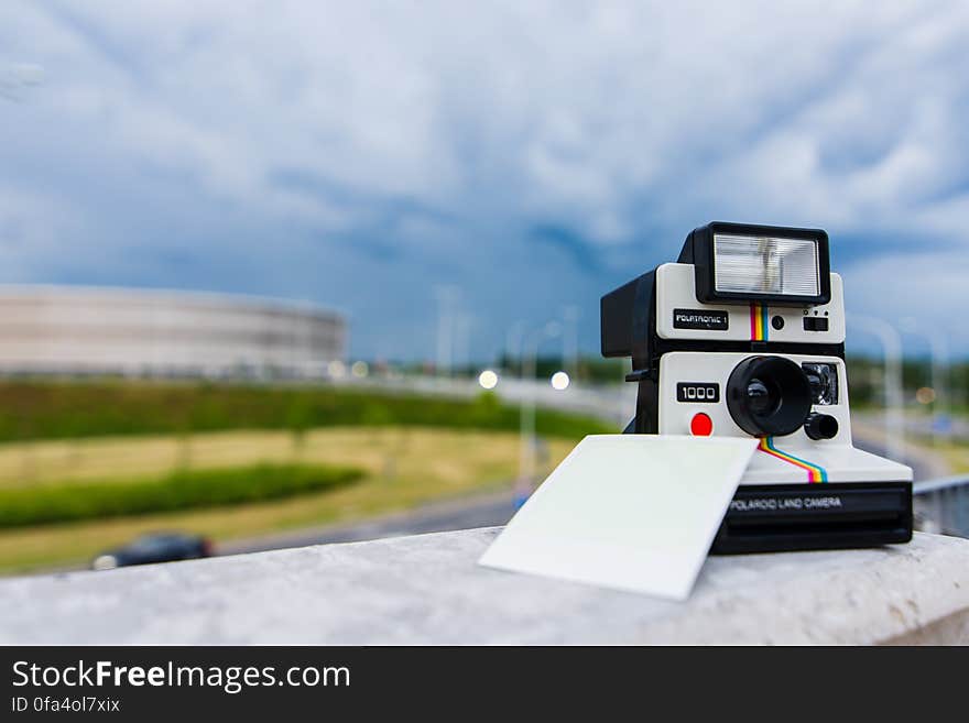 Black and White Polaroid Instant Camera With Photo Paper