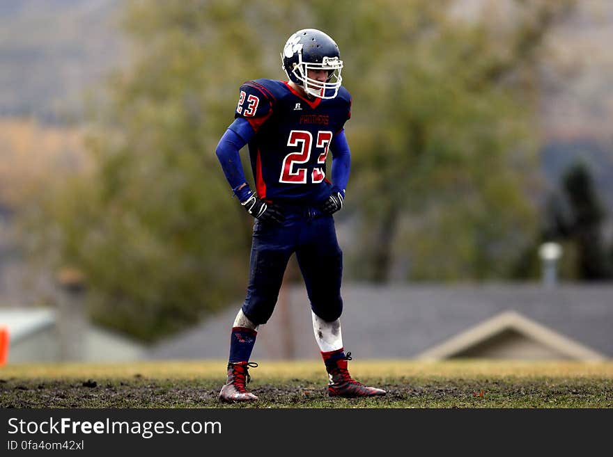 Football Player Wearing No. 23 Jersey Standing on Field